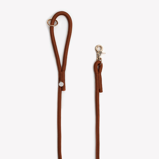 Brown Furlou leash with metal clip on a white background