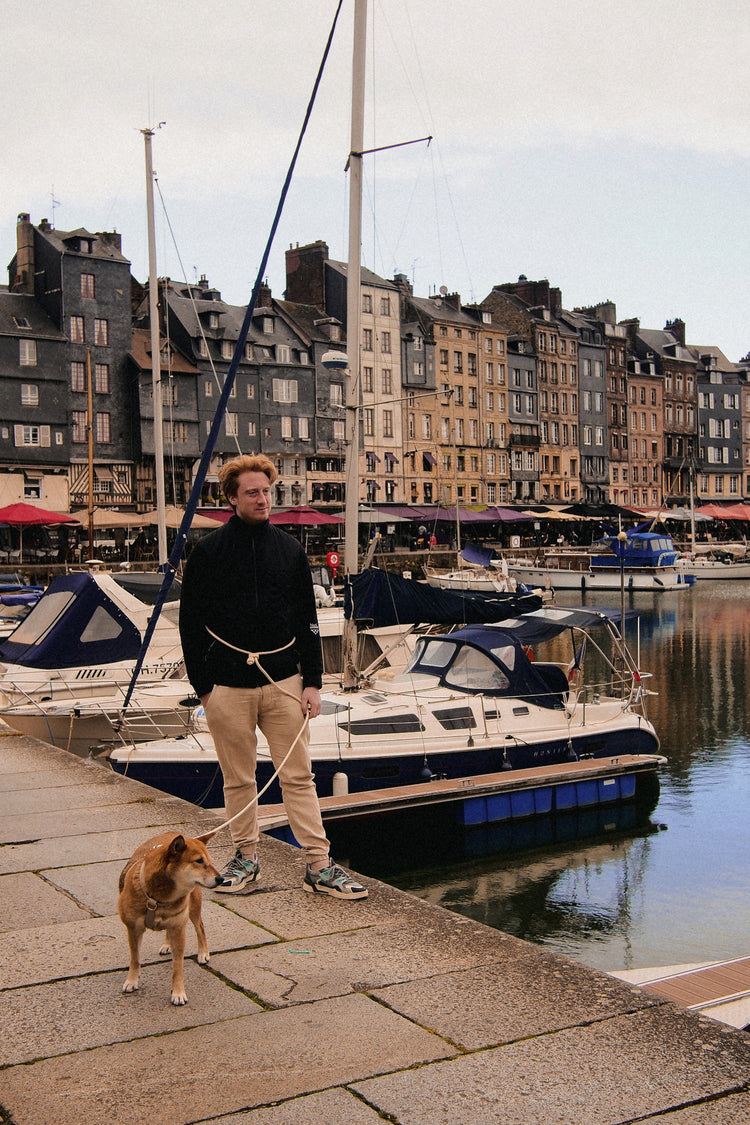 Handfree leash with a man and a dog at a french port.