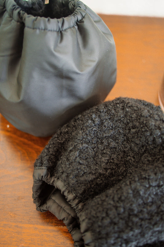 Two snoods of different colors on a wooden table