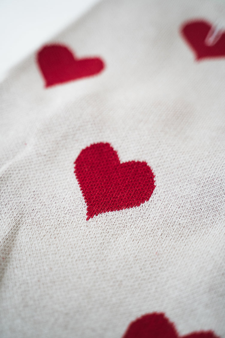 Close up on a hearts of the Lou and Co pullover tissue.