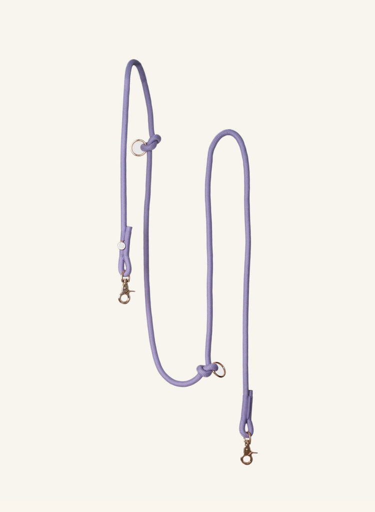 Purple Furlou leash with gold ends on a white background