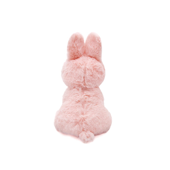 Pink plush bunny toy on a white background
