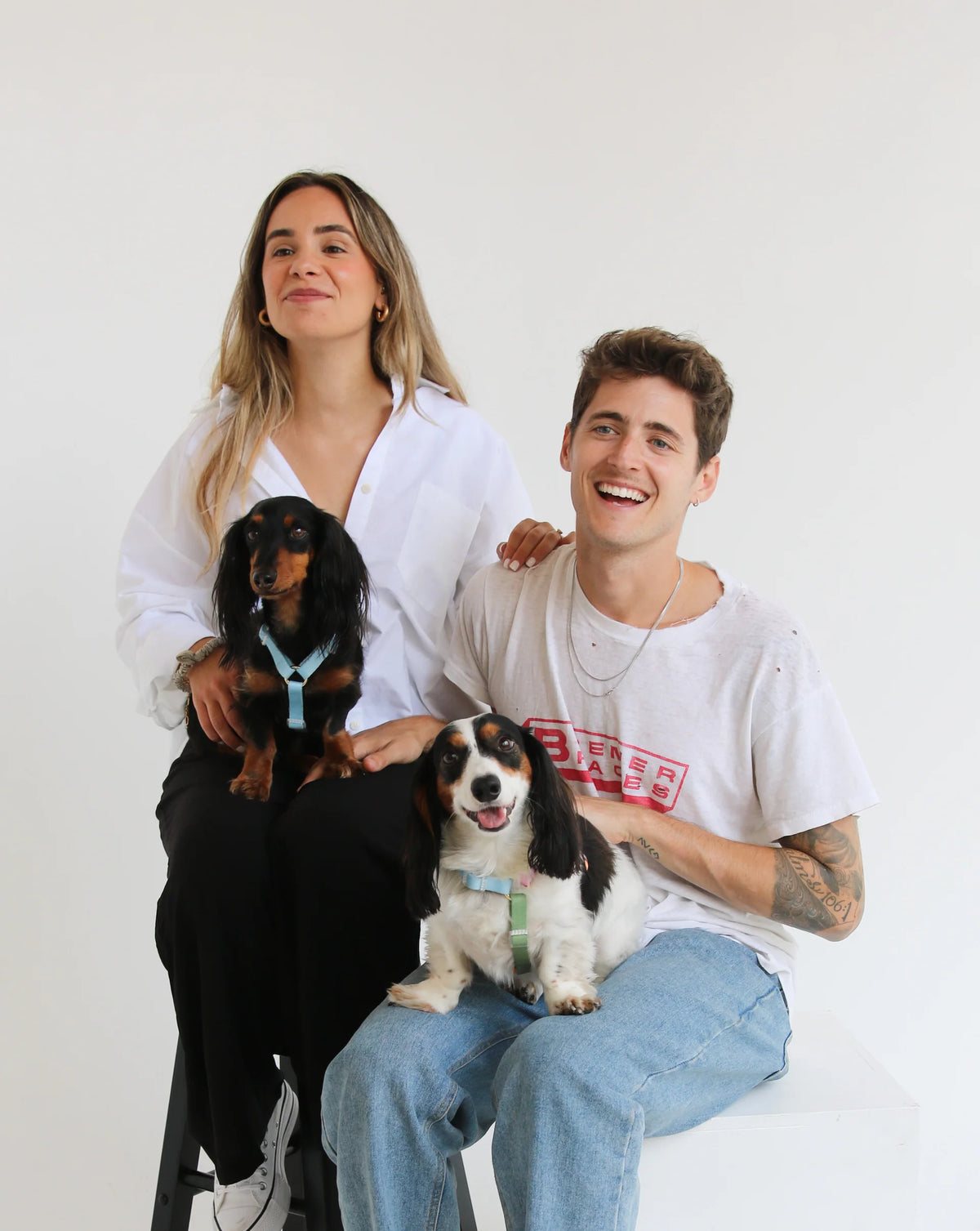 Furlou brand creators with two dogs on legs